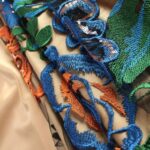 Blue, Purple and Orange Tulle adorned with floral embroidery
