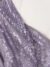 Purple tulle adorned with shiny embroidery