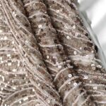 Brown Tulle adorned with semi-round striped embroidery