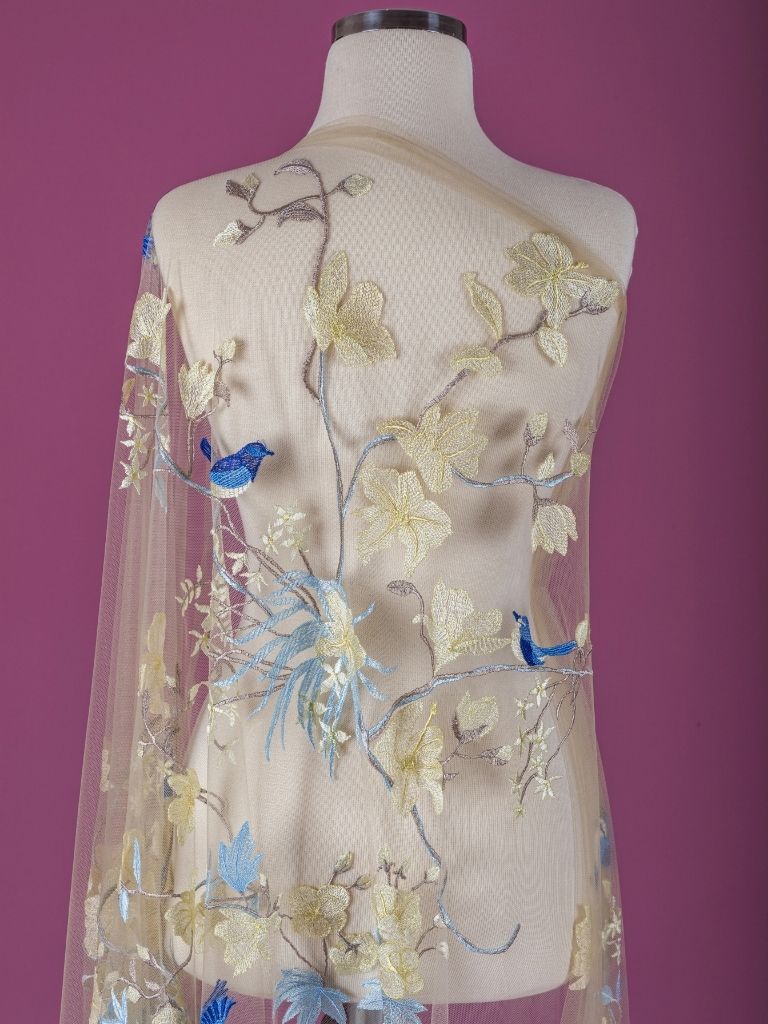 22-3204 Beige Tulle with light yellow and blue floral embroidery - Image 1