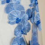 Tulle with deep-sea hue embroidery and lush bunches