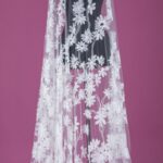 Ebony off white tulle adorned with elegant floral embroidery