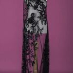 Tulle adorned with black embroidery