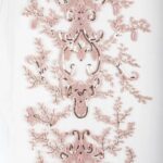 tulle adorned with baby pink embroidery