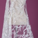 tulle adorned with white embroidery