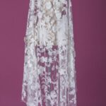 Off white tulle adorned with floral embroidery