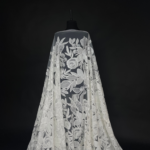 Off white Tulle with floral embroidery, subtle sequins, and beads