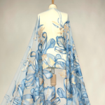 Blue tulle with large, flowy embroidered flowers