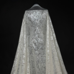 Off White Tulle fabric with round sequins for a sparkling, elegant touch