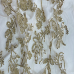 Golden Tulle fabric with round sequins for a sparkling, elegant touch