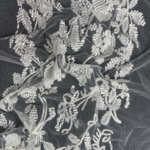 Off White Tulle fabric with round sequins for a sparkling, elegant touch