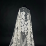 Off White Tulle with appliquéd flowers and pearl centers for a touch of elegance