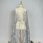 Tulle with geometric embroidery, sequins, and beads
