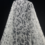 Off White Tulle with sequins in a patterned design