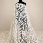 Elegant off white tulle with a sparkling sequin leaf pattern