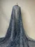 Glamorous blue tulle with shimmering leaf-patterned sequins and beads