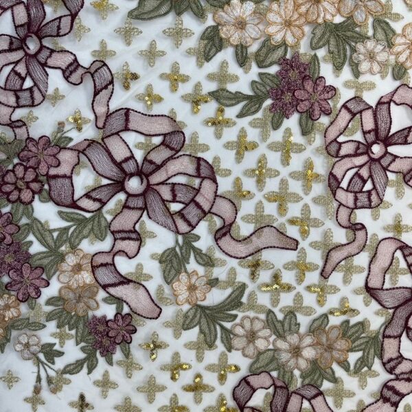 Light beige and burgundy coloured Tulle fabric adorned with floral embroidery