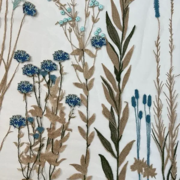 Golden and blue Tulle fabric adorned with floral embroidery