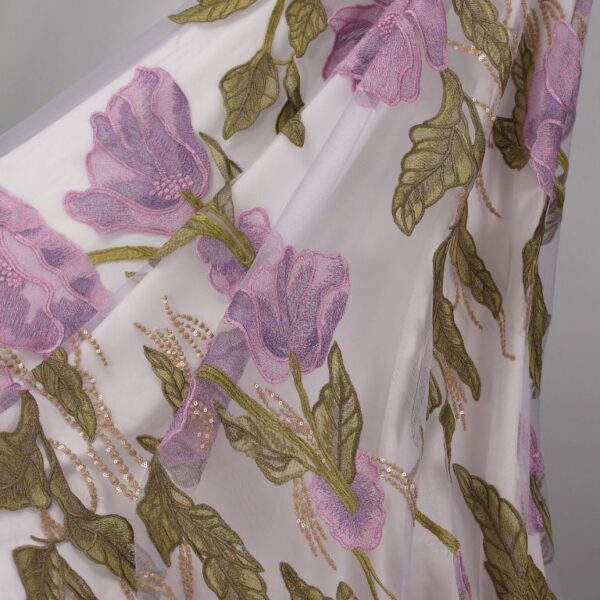 Purple Tulle fabric with beautifully embroidered flowers, adding a touch of delicate elegance