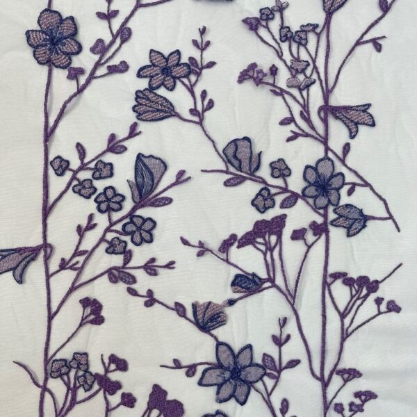 Mauve tulle fabric featuring floral embroidery