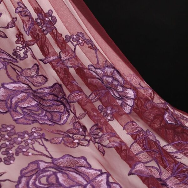 Purple tulle adorned with massive floral embroidery