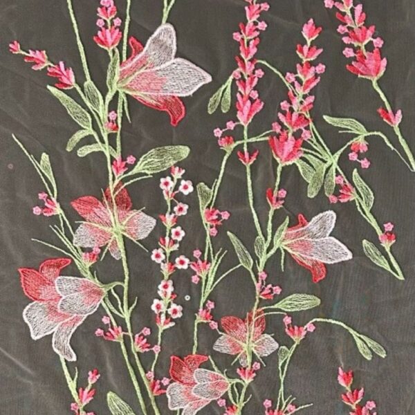 Pink and green tulle adorned with floral embroidery