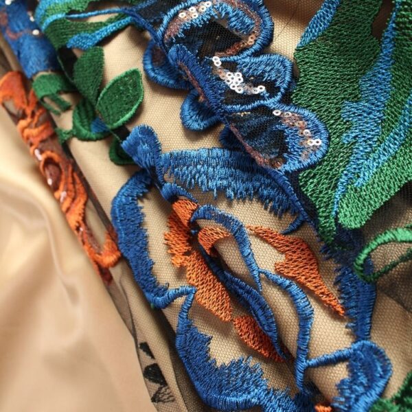 Blue, Purple and Orange Tulle adorned with floral embroidery