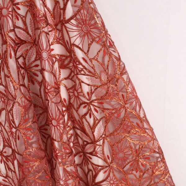 Red Tulle adorned with embroidery