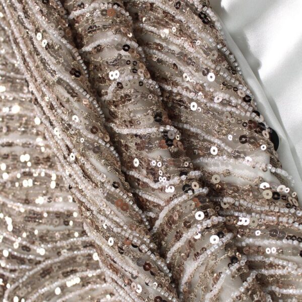 Brown Tulle adorned with semi-round striped embroidery