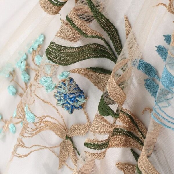 Golden and blue Tulle fabric adorned with floral embroidery