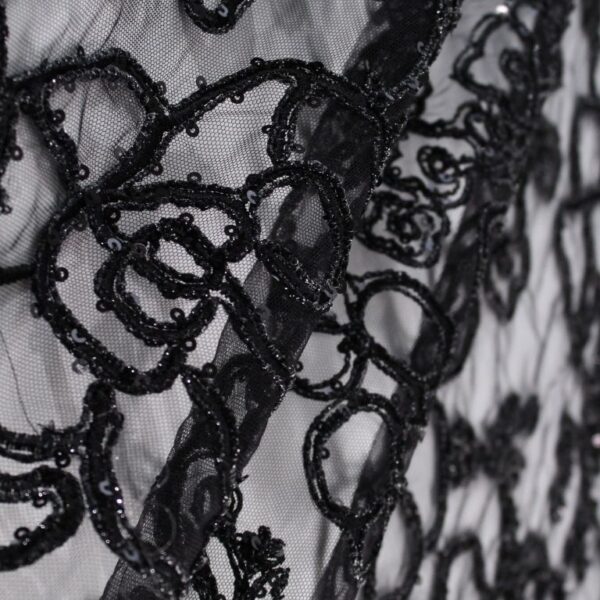 Black Tulle fabric adorned with floral embroidery