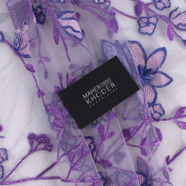 Mauve tulle fabric featuring floral embroidery
