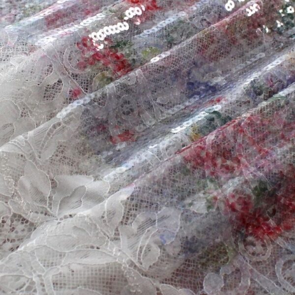 Purple and orange tulle fabric adorned with floral embroidery