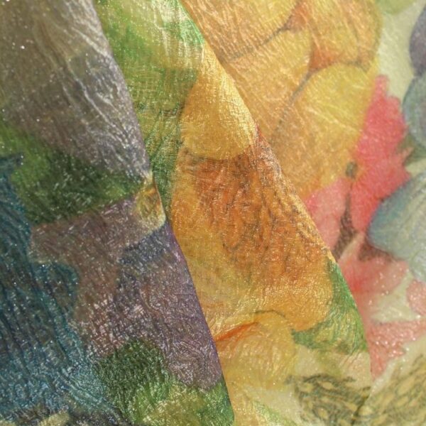 Yellow, pink and blue tulle adorned with floral embroidery