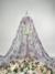 Tulle fabric with beautifully embroidered flowers, adding a touch of delicate elegance