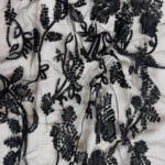 Black Tulle fabric with round sequins for a sparkling, elegant touch