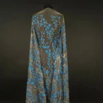 Transparent tulle with beautiful and tiny blue floral embroidery