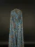 Transparent tulle with beautiful and tiny blue floral embroidery